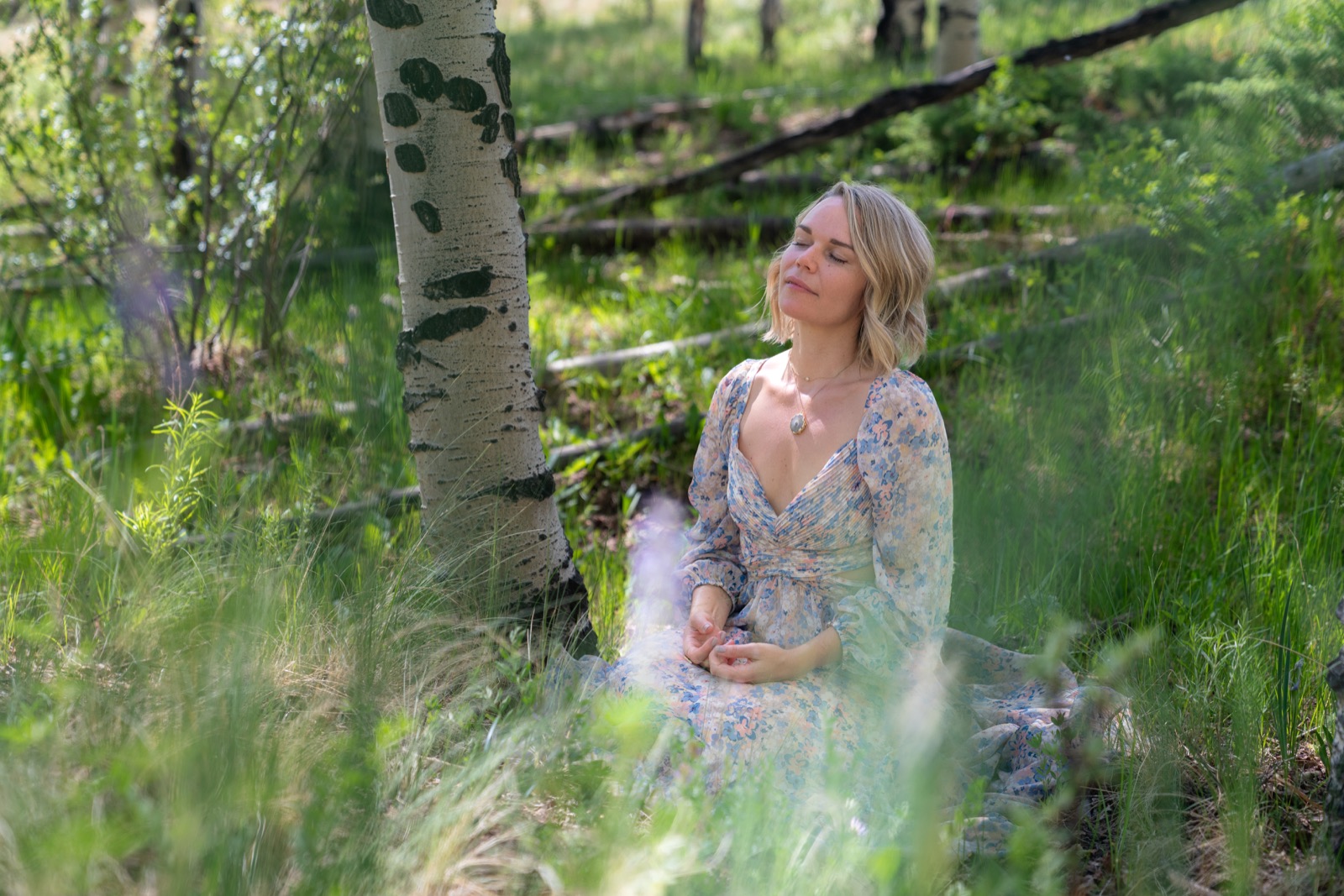 Nicole Marie Rose meditating among aspen trees